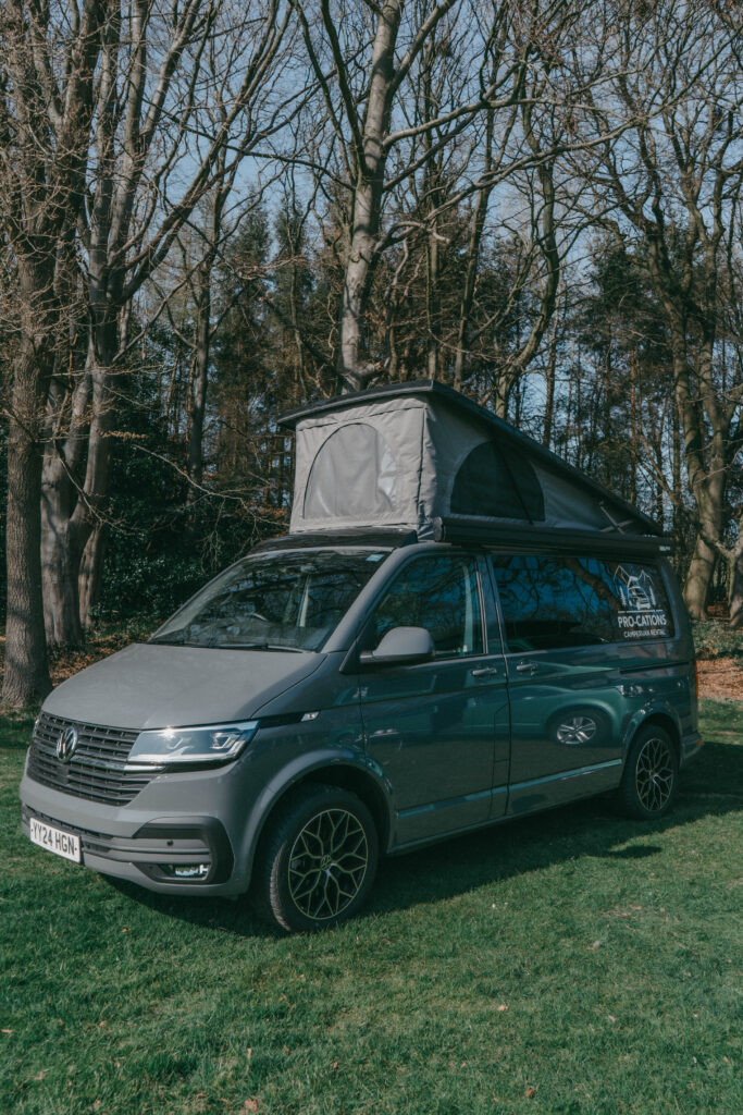 Pedro the camper with mountain view pop top open